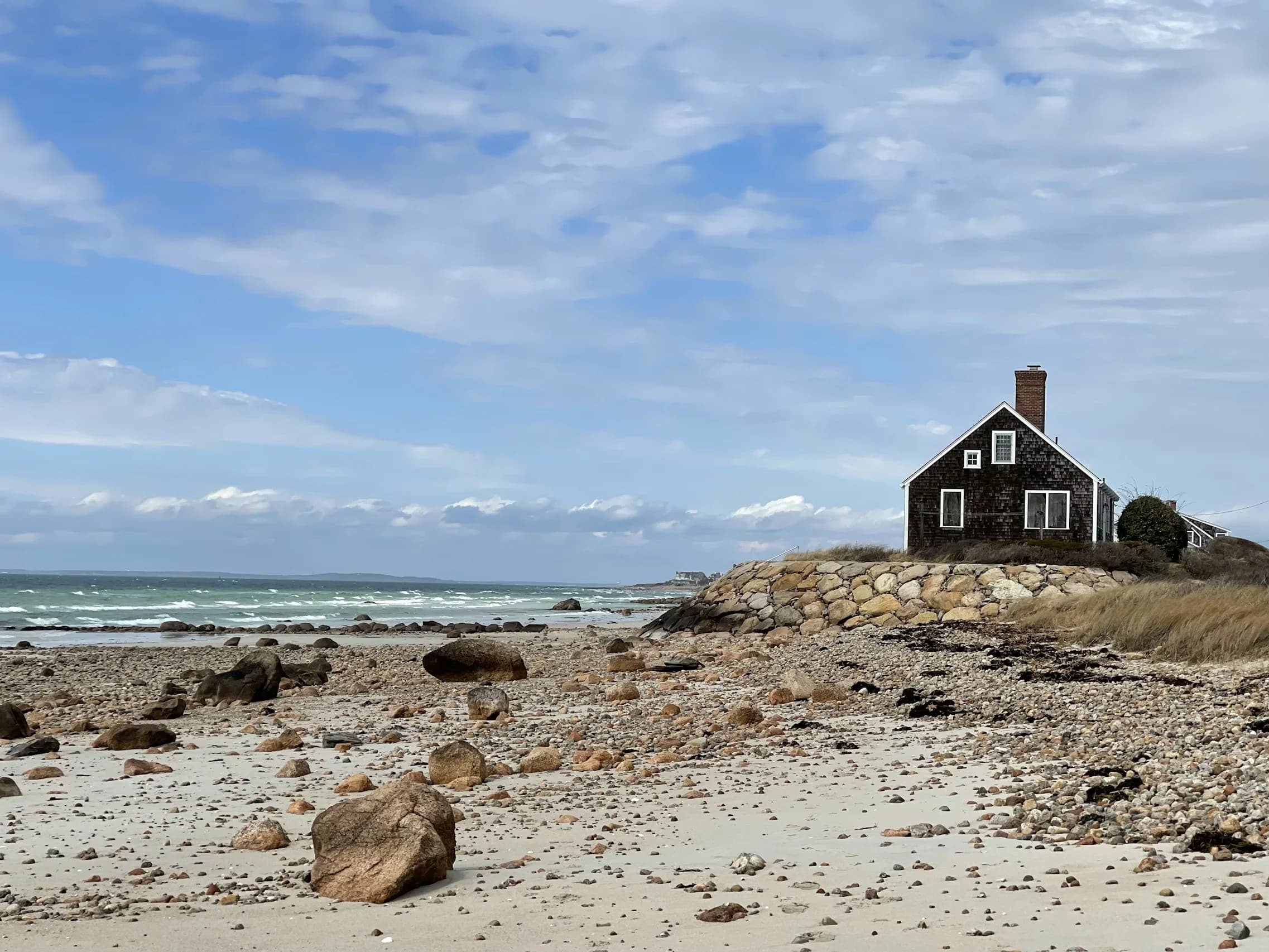 Tidal flats stretching to the horizon under a soft Cape Cod sky