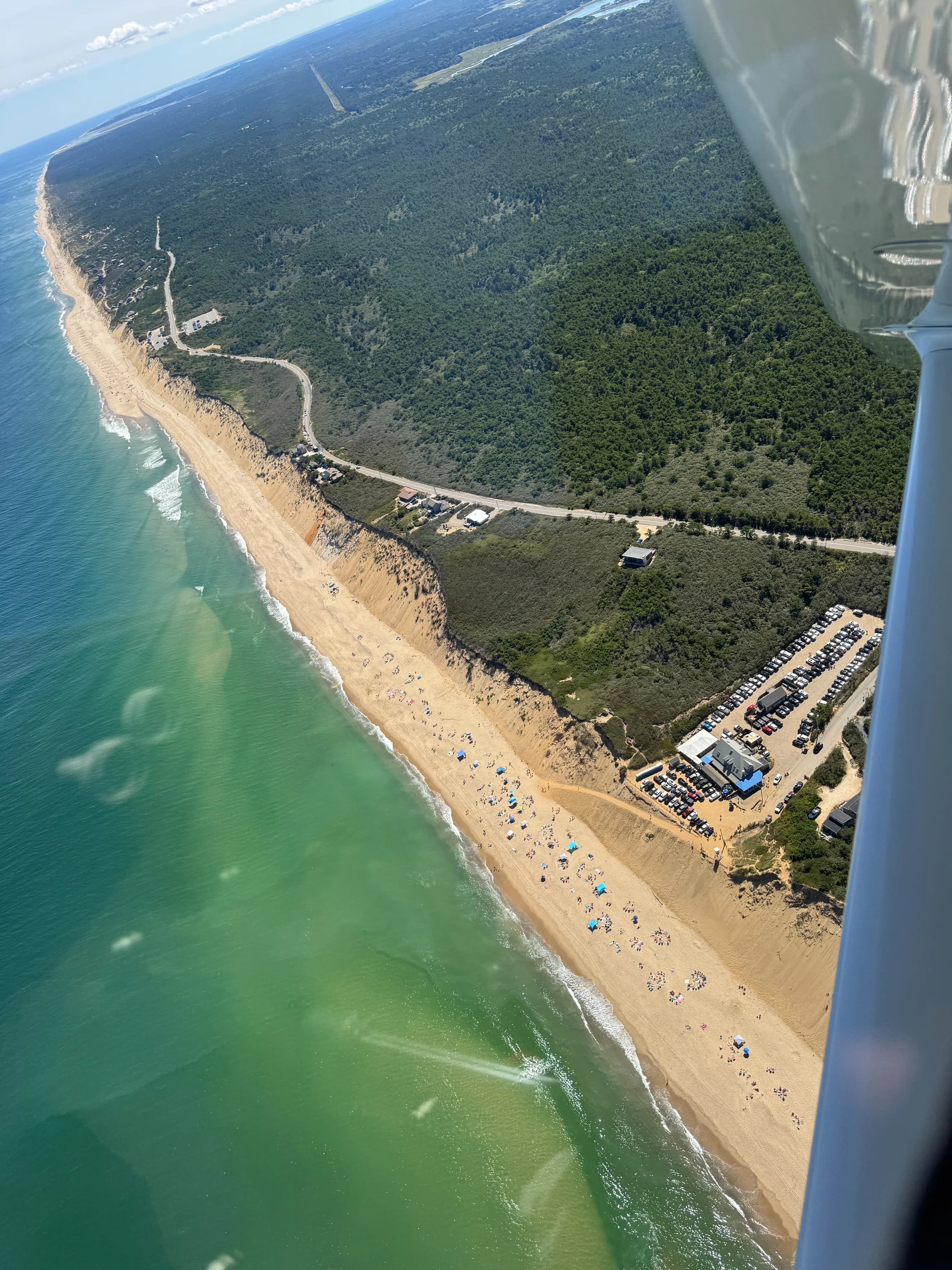 Aerial coastal view near Chatham showing the shoreline and runway approach