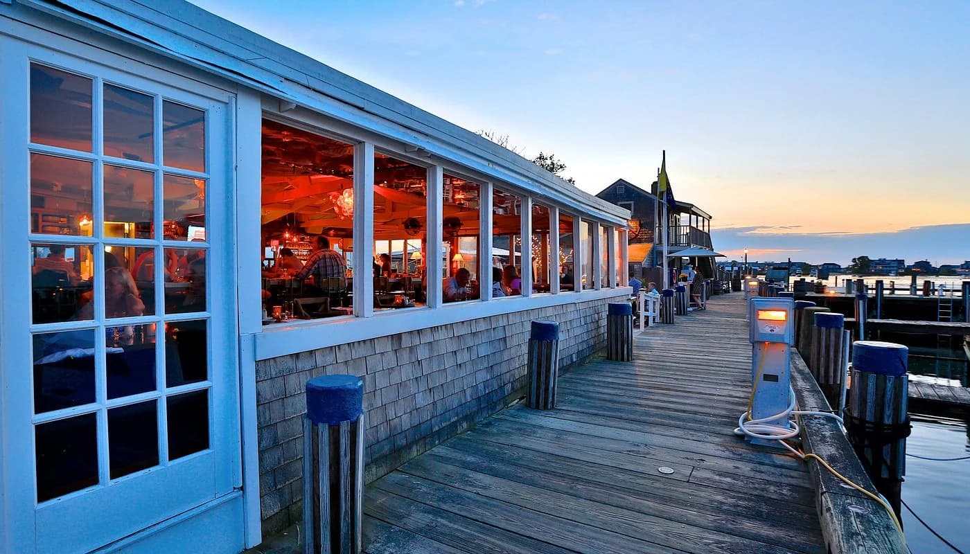 Harborfront dining terrace at Cru