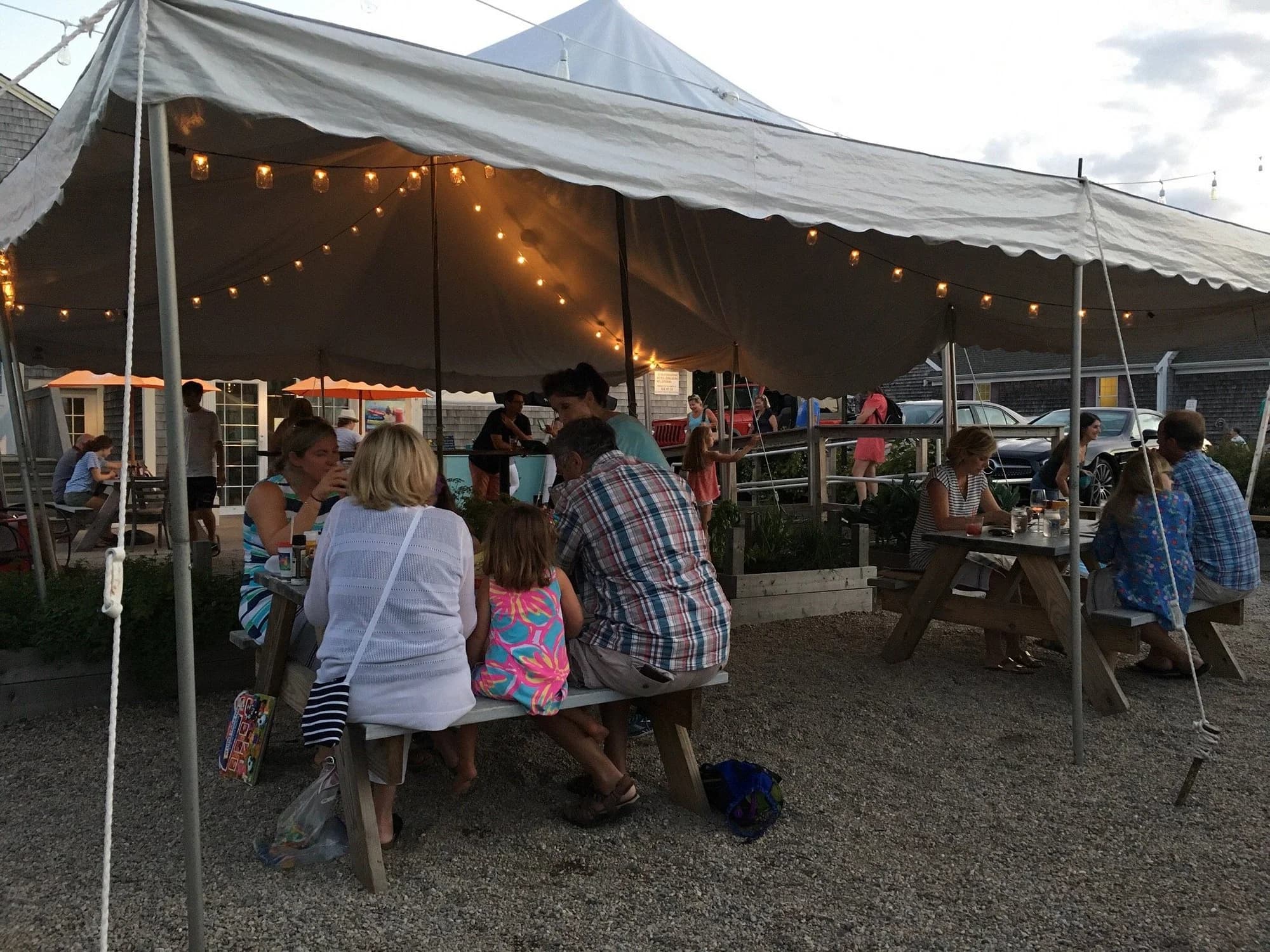 String lights and outdoor seating at The Mad Minnow