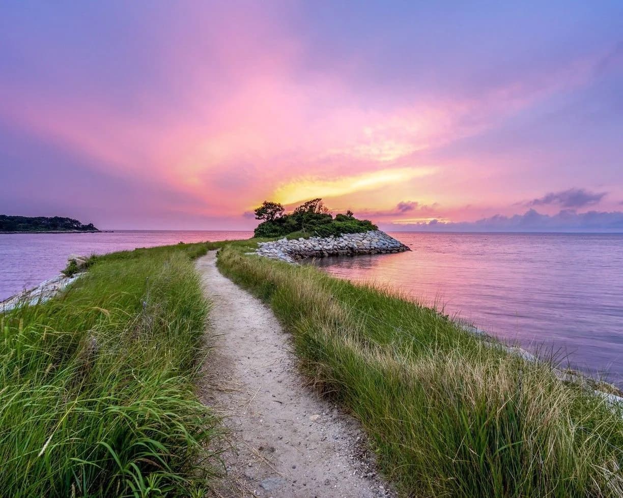 Scenic Cape Cod coastal path at sunset leading to a small island