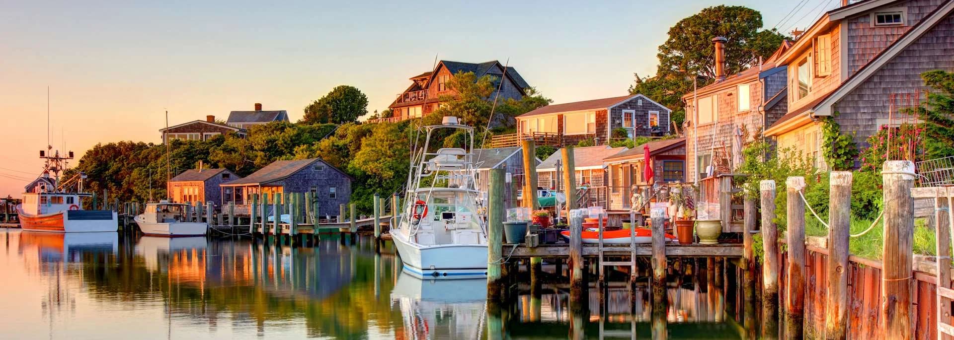 A historic Martha’s Vineyard harbor lined with weathered buildings