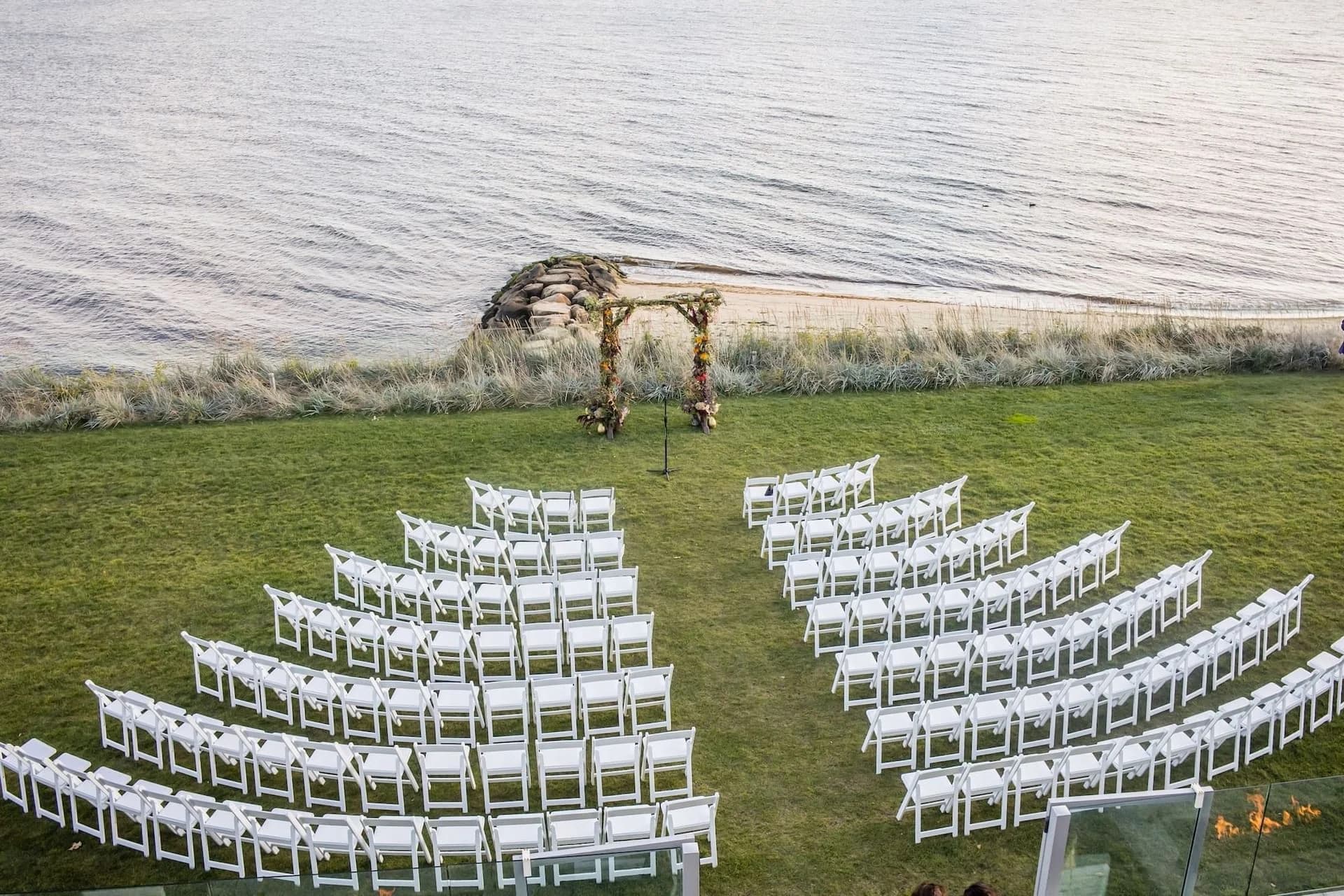 Waterfront ceremony setup at Pelham House Resort overlooking the ocean